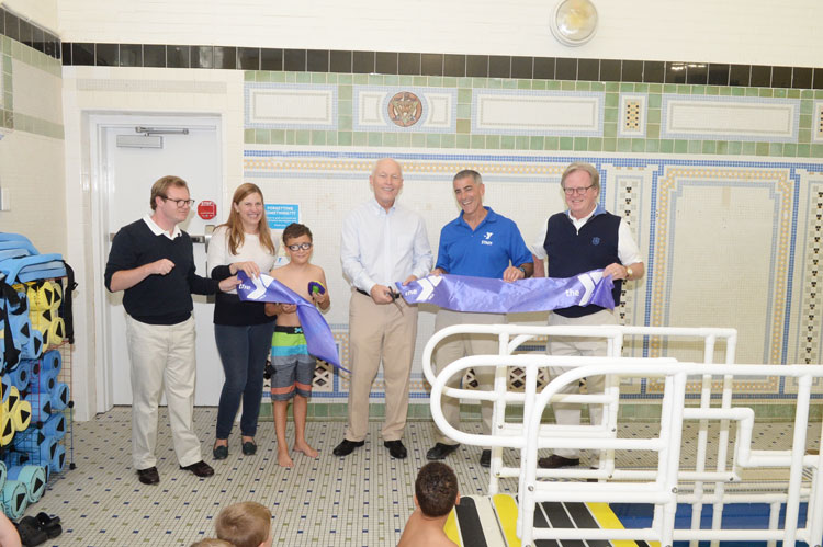 To commemorate the start of the program, YMCA CEO Bob DeAngelo, Abilis Community Foundation President Hal Ritch and Abilis CEO Dennis Perry presided over a brief ribbon cutting ceremony welcoming the participants and their families.