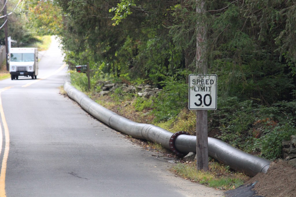 Water is being pumped from the Bargh Reservoir in Stamford to the Putnam Reservoir in Greenwich via above-ground pipes. (Evan Triantafilidis photo)