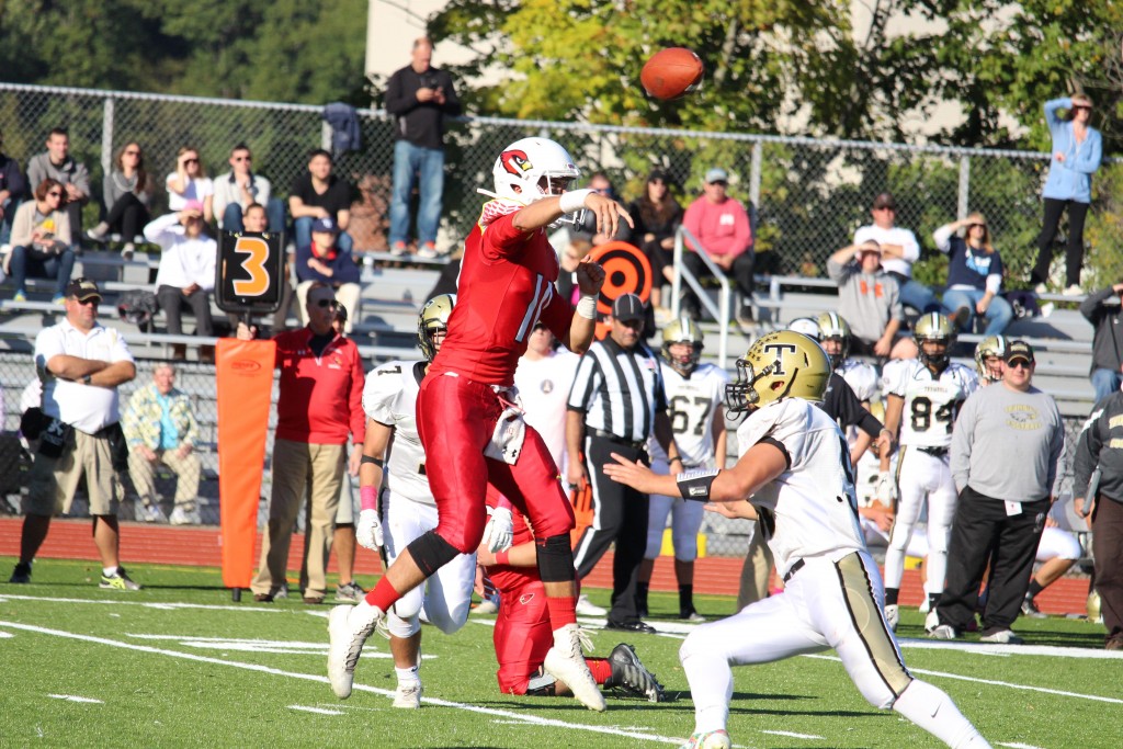 Connor Langan attempts a pass in Saturday's win over Trumbull (Evan Triantafilidis photo)