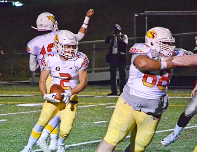 Greenwich High School's Kevin Iobbi looks to pick up some key yards on the ground during Big Red's game against New Canaan. (Paul Silverfarb photo)