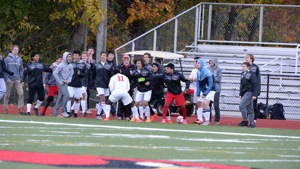 The Greenwich High boys soccer team celebrates after earning a penalty kick late in their FCIAC quarterfinal against Staples - John Ferris Robben photo