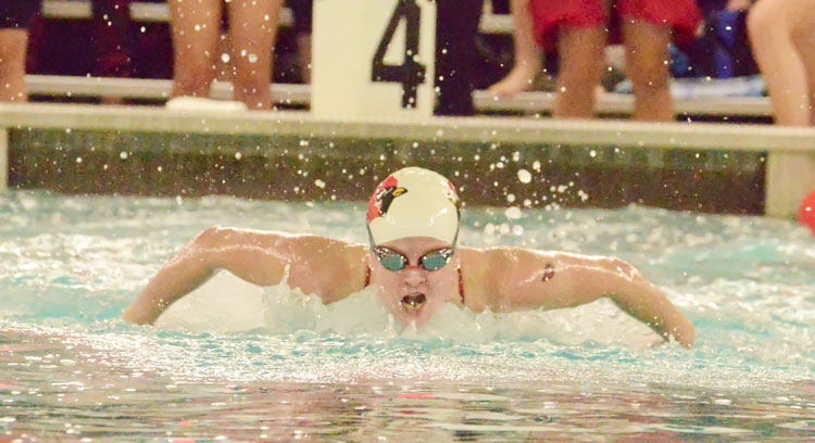 Greenwich High School junior Kelly Montesi competes in the 100-yard butterfly during the FCIAC championship meet Thursday night. (John Ferris Robben photo)