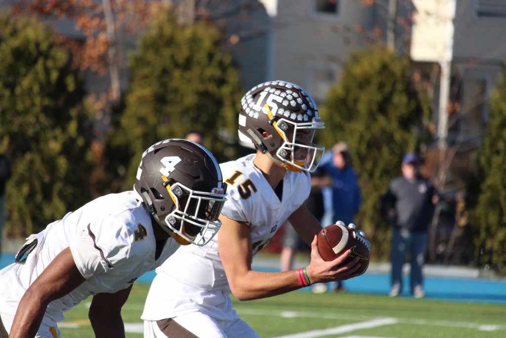 Brunswick's Nick Henkel takes a snap during Saturday's bowl game (Evan Triantafilidis photo)