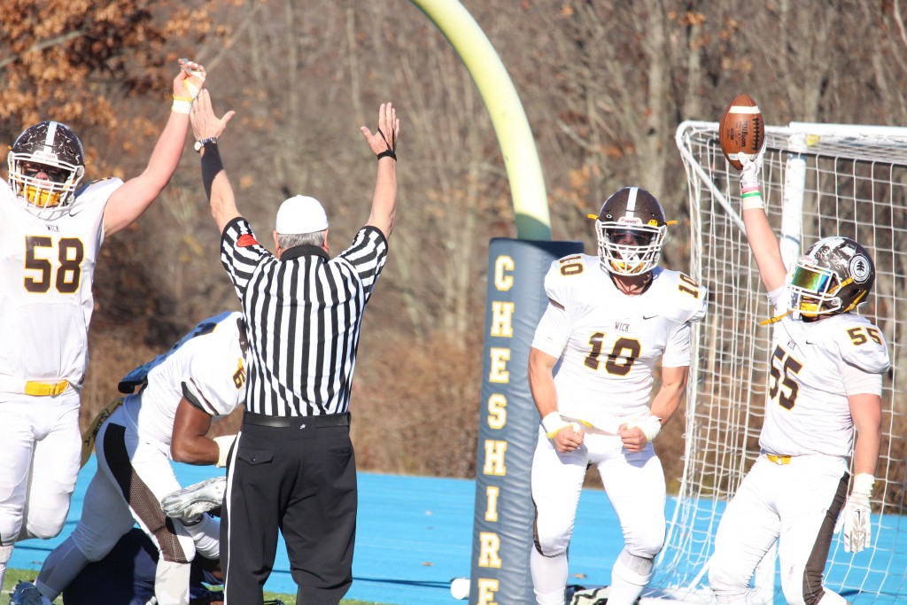 Brunswick's defense celebrates after scoring a touchdown in Saturday's bowl game (Evan Triantafilidis photo)