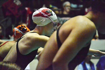 The Greenwich High School 400-yard freestyle relay team gets ready to hit the water during Saturday's finals. (Paul Silverfarb photo)