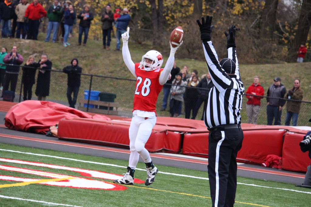 Greenwich's Matt Morganti celebrates after catching a touchdown pass against Staples (Evan Triantafilidis photo)