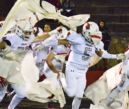 The Greenwich High School football team was fired up as they entered Boyle Stadium for competition in the CIAC class LL quarterfinals against Darien High School Tuesday night. (Paul Silverfarb photo)