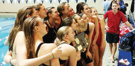 GHS head diving coach Sergey Meshcherskiy looks on as the Cardinals celebrate the CIAC state open champoinship. (Paul Silverfarb photo)
