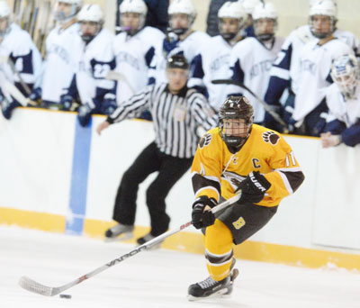 Senior captain Christian LeSueur takes the puck deep in the Hotchkiss zone during Brunswick's home game Monday night. (John Ferris Robben photo)