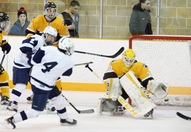 Brunswick School senior goalie Strauss Mann makes one of his 26 saves on the day against Hotchkiss School Monday night at home. (John Ferris Robben photo)