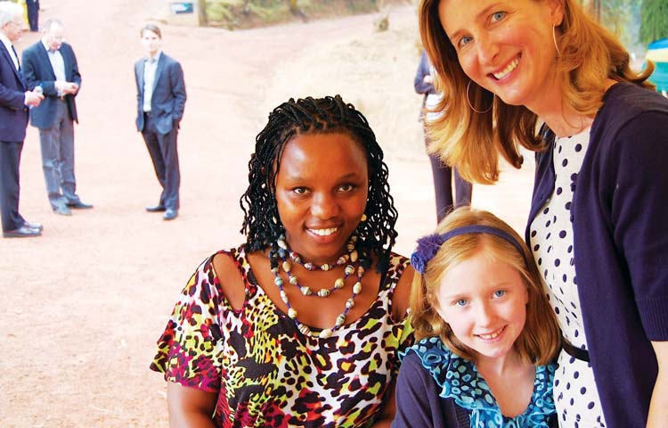 In her support of Partners in Help, Lesley King brought into her family fold Rwandan genocide and cancer survivor Claudine Humure, pictured here with Lesley’s daughter, Moira. (contributed photo)