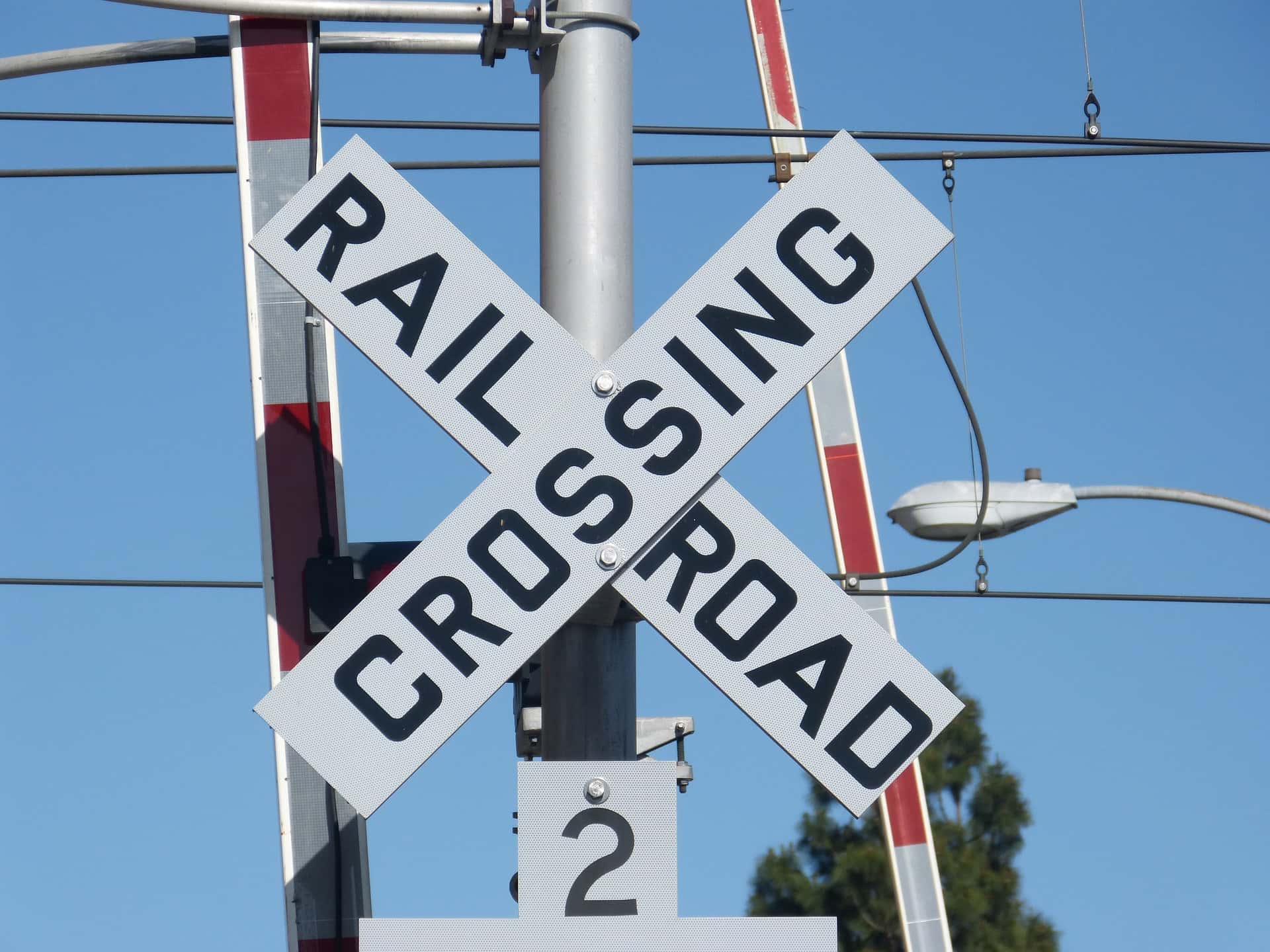 Railroad crossing gate lights train track railroads trains transportation freight
