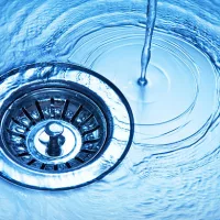 close-up-of-kitchen-sink-with-water-running-away