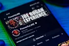 Joe Rogan experience podcast on smartphone screen.