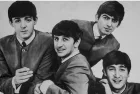 Vintage photo Portrait of The Beatles musical band group. Old textured vintage black and white photograph 1960s-70s