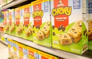 A view of several boxes of Chewy chocolate chip granola bars^ on display at a local grocery store.