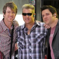 Guitarist Joe Don Rooney^ singer Gary Levox and bassist Jay DeMarcus of Rascal Flatts perform on NBC's Today Show in Rockefeller Plaza on June 11^ 2010 in New York City.