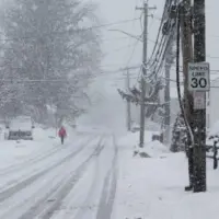 Person is walking in snow storm day on North Taylor Avein Norwalk NORWALK^ CT^ USA -FEBRUARY 7^ 2021
