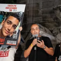 Adi Alexander speaks with Yael at his side^ parents of Edan Alexander at rally and memorial service for 6 hostages who were kidnapped and murdered by Hamas on Columbus Circle in New York on Sep 1 2024