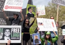 Activists gathered in front of Federal Court where Luigi Mangione was arraigned on Federal Charges accusing him of killing United HealthCare CEO Brian Thompson New York - April 25^ 2025