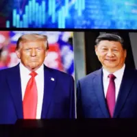 U.S. President Donald Trump and Chinese President Xi Jinping appear on a smartphone screen