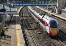 LNER Azuma heads south through the station at Huntingdon^ Cambridgeshire^ England HUNTINGDON^ CAMBRIDGESHIRE/UK - October 9^ 2019
