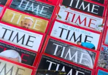 Colorful close-up of overlapping TIME Magazine covers^ highlighting diverse headlines on world leaders^ politics^ business^ and social issues. Calgary^ Alberta^ Canada. Dec 1^ 2025