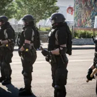 Minneapolis^ Minnesota / USA - May 29 2020: close up state patrol police officers standing guard towards minneapolis riots for George Floyd