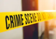 crime scene tape in front room door with flare and vintage tone