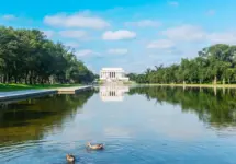 World famous Lincoln Memorial reflected in the water under a cloudy sky. Washington D.C.^ USA