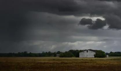 tornado-storm-clouds-above-the-shed-in-the-countryside