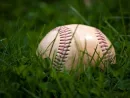 old-baseball-in-the-grass