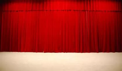 red-draped-theater-stage-curtains