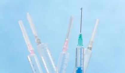syringes-with-liquid-drop-falling-from-needle