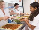 schoolgirl-holding-plate-of-lunch-in-school-cafeteria-2
