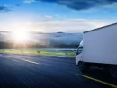truck-traveling-on-road-at-sunrise-speed-and-delivery-concept