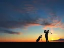 man-golf-player-hit-ball-to-air-silhouetted