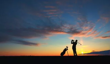 man-golf-player-hit-ball-to-air-silhouetted