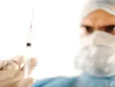 surgeon-holding-injection-vaccine