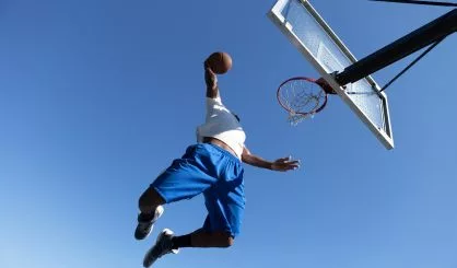 man-dunking-a-basketball