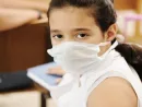 schoolgirl-with-medicine-mask-on-face-in-classroom-against-virus-ill-epidemic-plague-flu