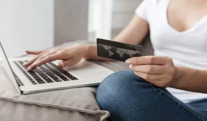 woman-with-laptop-and-credit-card-doing-online-shopping