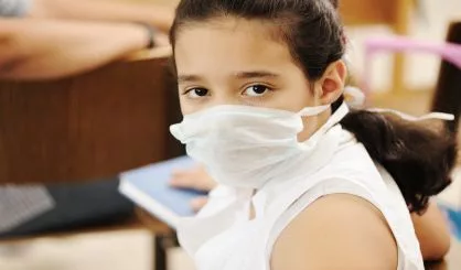 schoolgirl-with-medicine-mask-on-face-in-classroom-against-virus-ill-epidemic-plague-flu-2