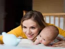 mother-with-her-newborn-baby-son-lying-on-bed