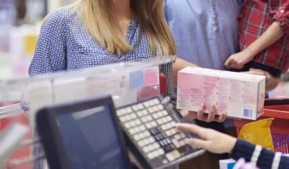 family-packing-shopping-at-supermarket-checkout