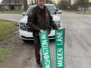 Berrien County Sheriff's Deputy Don Goulooze holds damaged signs