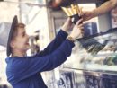 female-customer-reaching-food-from-vendor-2