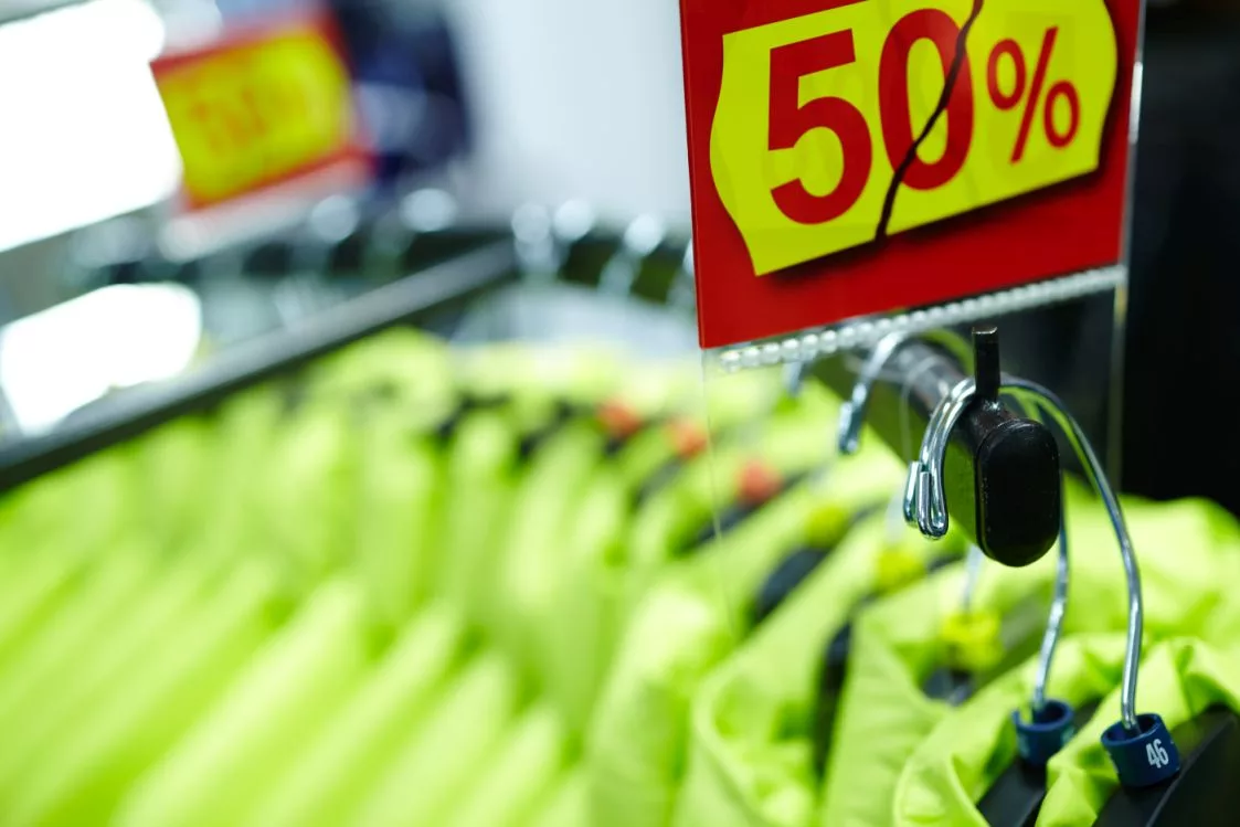 sport-and-casual-clothes-on-hangers-in-the-shop