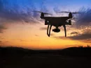 silhouette-of-hovering-drone-taking-pictures-of-nature-at-sunset-2