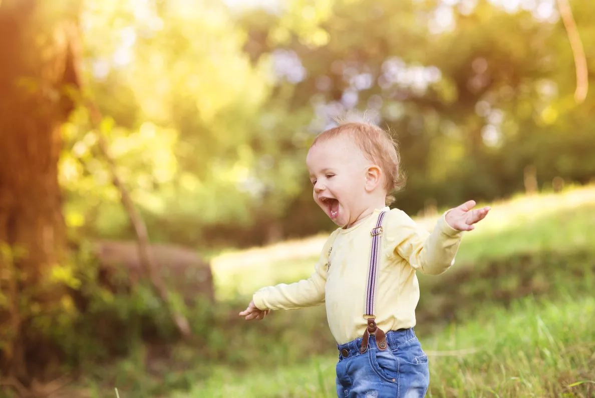 little-boy-having-fun-on-a-meadow